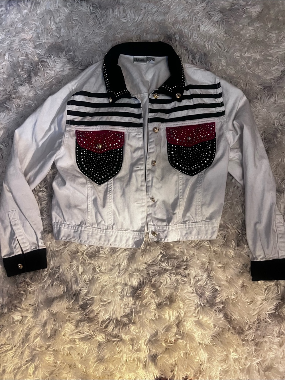 White Denim Jacket with Black Trim and Red Studded Pocket Flaps